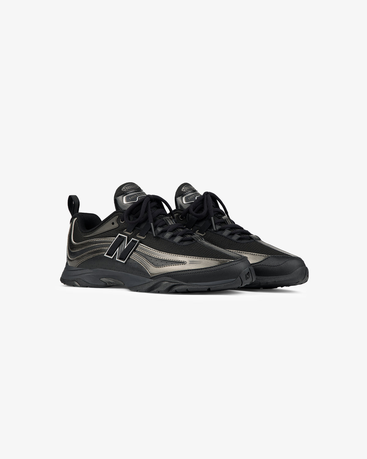A pair of ALD / New Balance RC56 black and gray lace-up sneakers on a plain white background.
