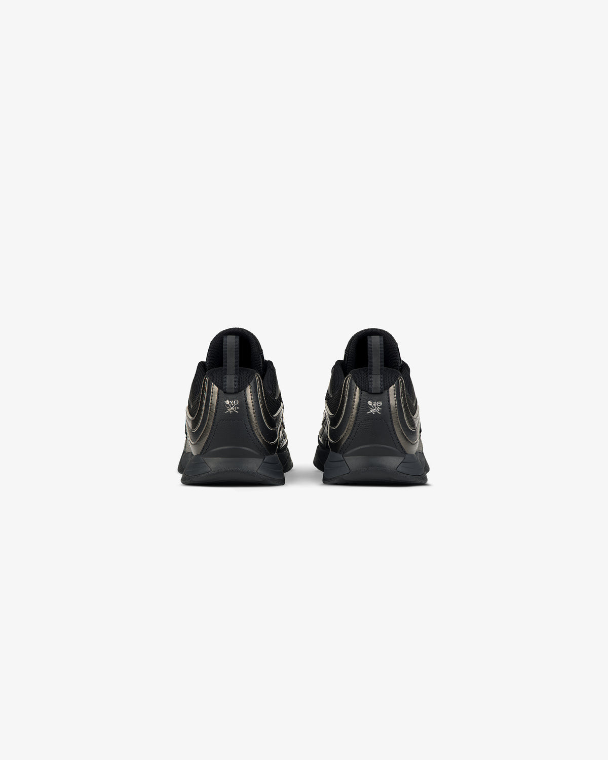 Rear view of ALD / New Balance RC56 black sneakers with metallic gold accents on a plain white background.