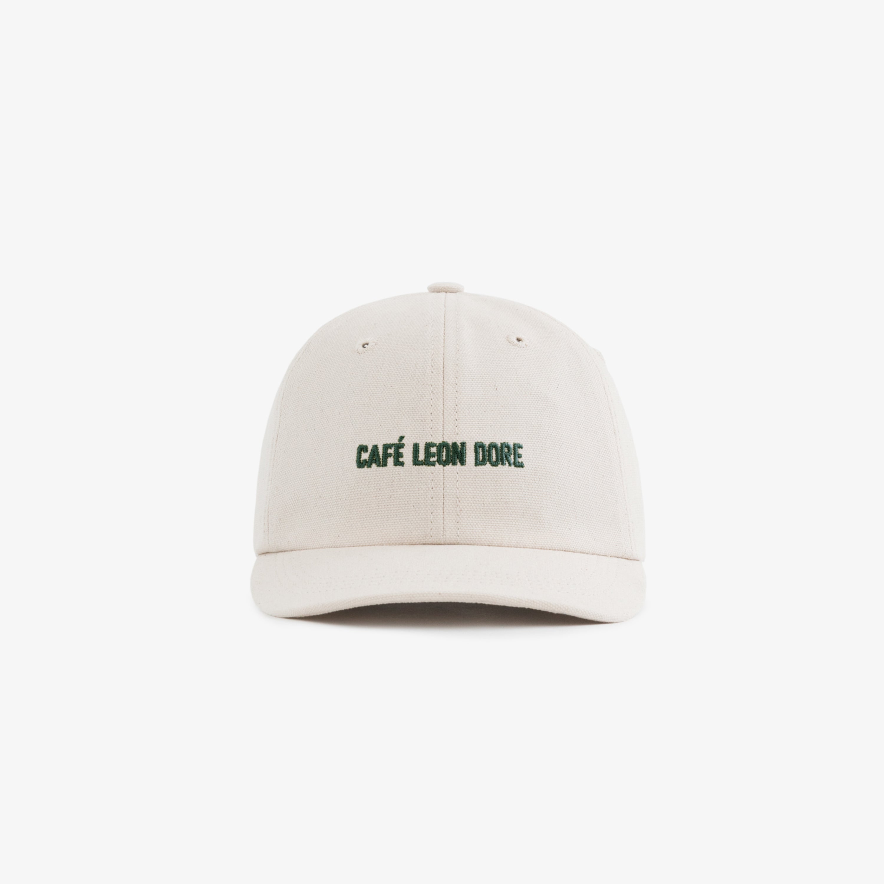Café Leon Dore Hat in beige with green embroidered logo on the front, displayed against a white background.