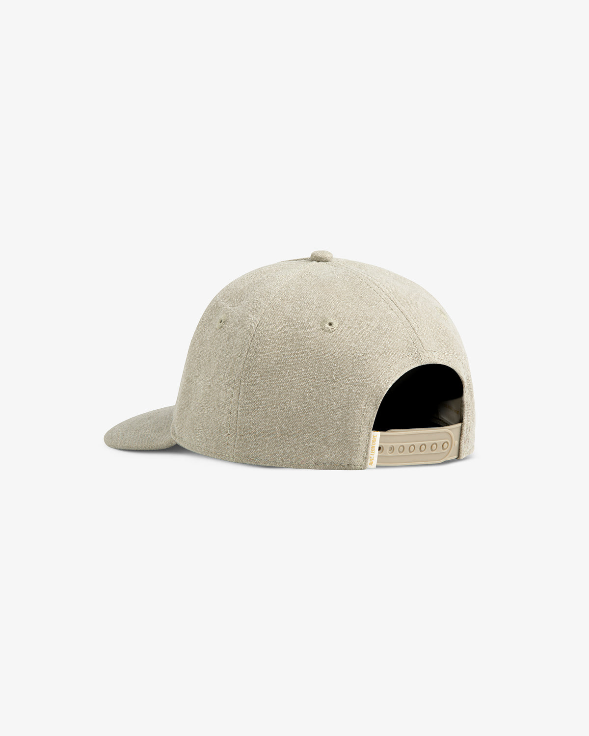 Micro Logo Hat in beige shown from the back with adjustable snap closure and curved brim on white background.