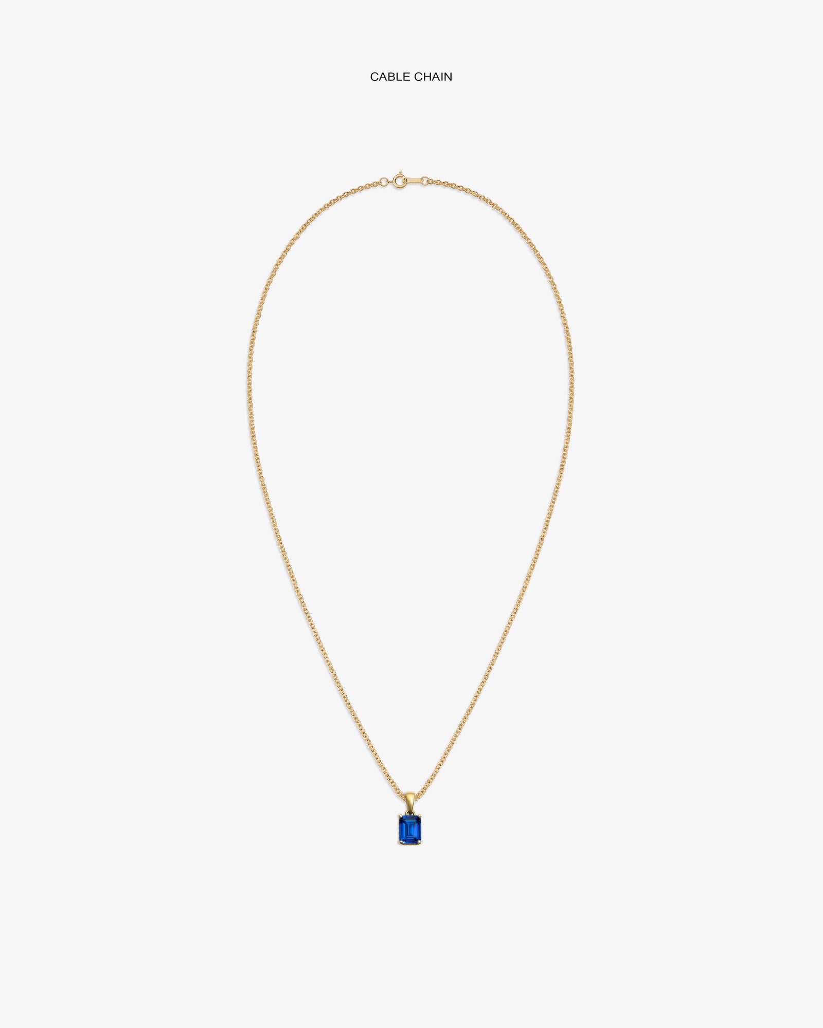 14Kt Gold Gemstone Pendant with rectangular blue stone on gold cable chain, displayed on white background.