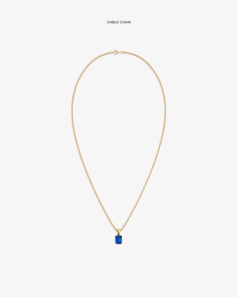 14Kt Gold Gemstone Pendant with rectangular blue stone on gold cable chain, displayed on white background.