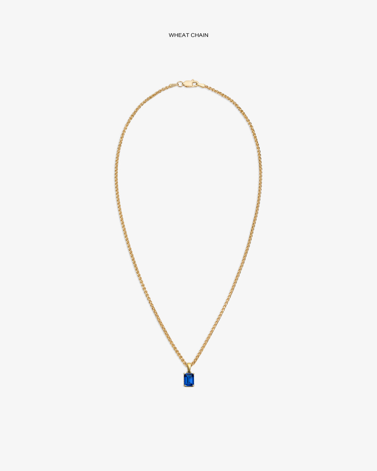 14Kt Gold Gemstone Pendant on a wheat chain, featuring a rectangular blue stone, shown on a white background.