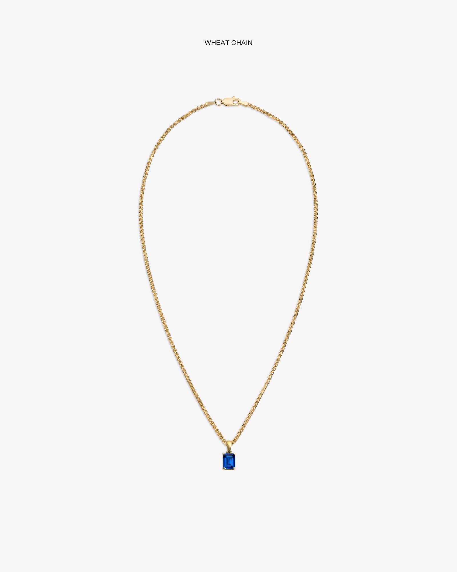 14Kt Gold Gemstone Pendant on a wheat chain, featuring a rectangular blue stone, shown on a white background.