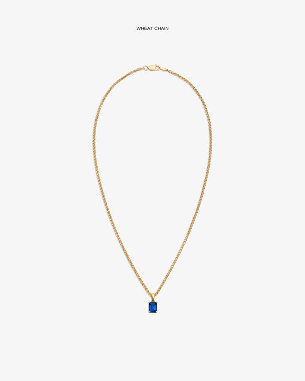 14Kt Gold Gemstone Pendant on a wheat chain, featuring a rectangular blue stone, shown on a white background.