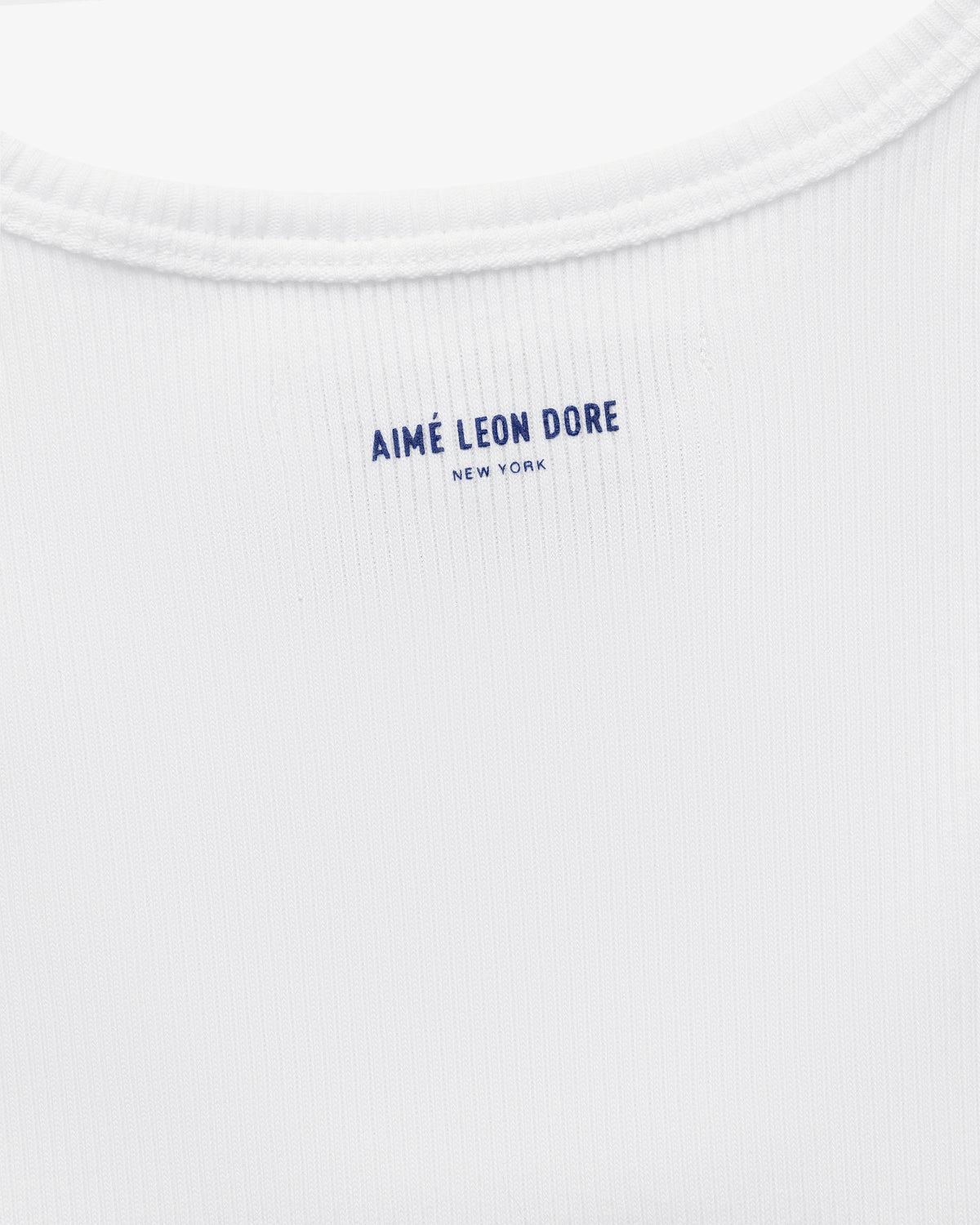 Close-up of the back neck area of the white Mets Tank Top with AIMÉ LEON DORE NEW YORK printed in blue text.