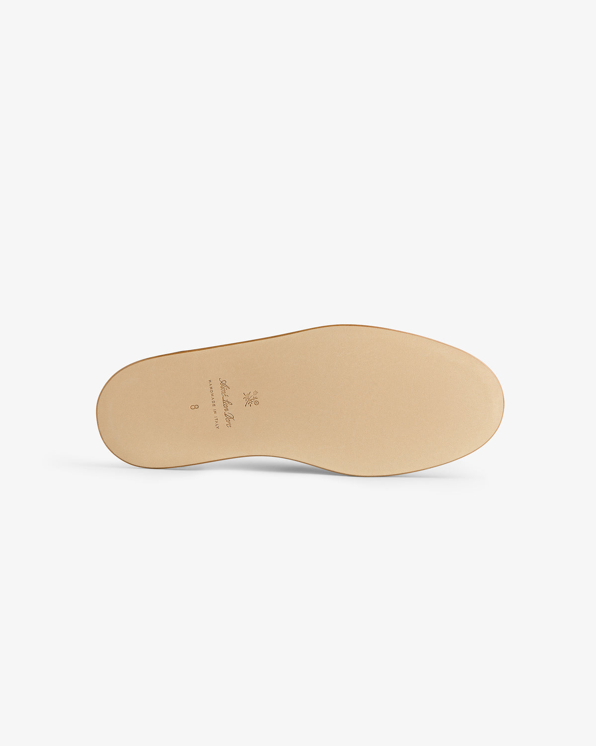 Tan nubuck Travel Slipper sole, minimal tread, viewed from below with small stamped logo and text.