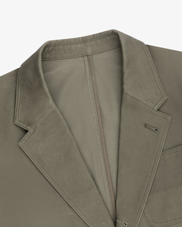 Single-Breasted Washed Twill Suit Jacket in olive green laid flat to display lapel, collar, and chest pocket.