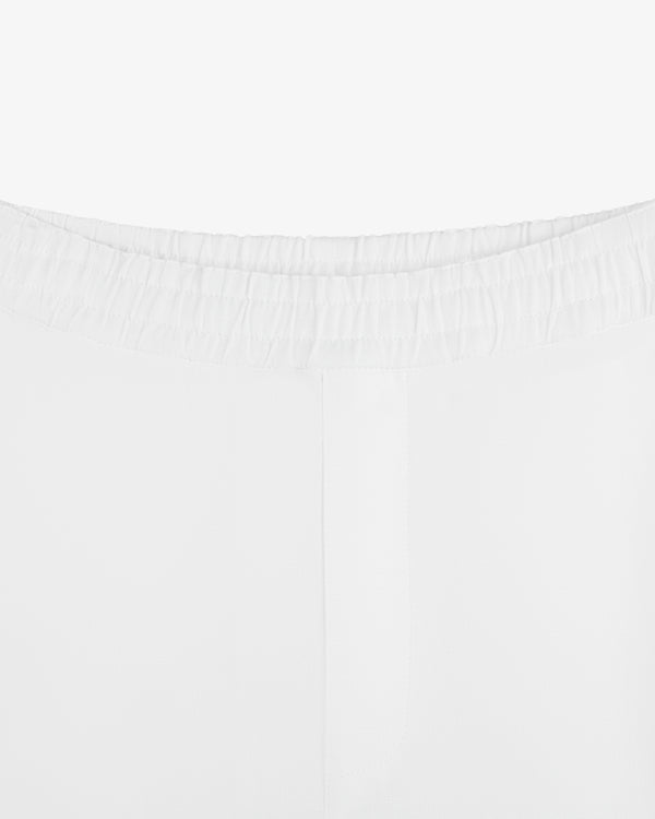 Close-up of the waistband and upper back of Linen Leisure Pant in white, featuring a comfortable elastic waistband.