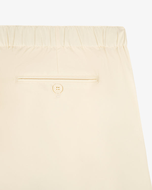 Cotton Casual Pant: beige, elastic waistband, single back pocket with button closure.