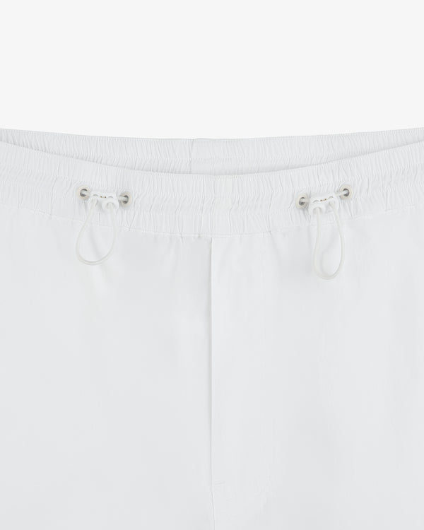 Close-up of the Windbreaker Pant waistband in white, featuring an elastic band and two front drawstrings.