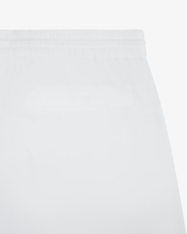Close-up of Windbreaker Pant in white, featuring an elastic waistband and a single back pocket.