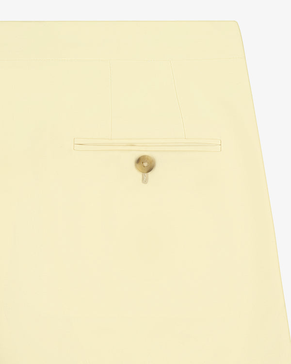 Back pocket of Gabardine Suit Trouser in cream with beige button and minimalist stitching details.