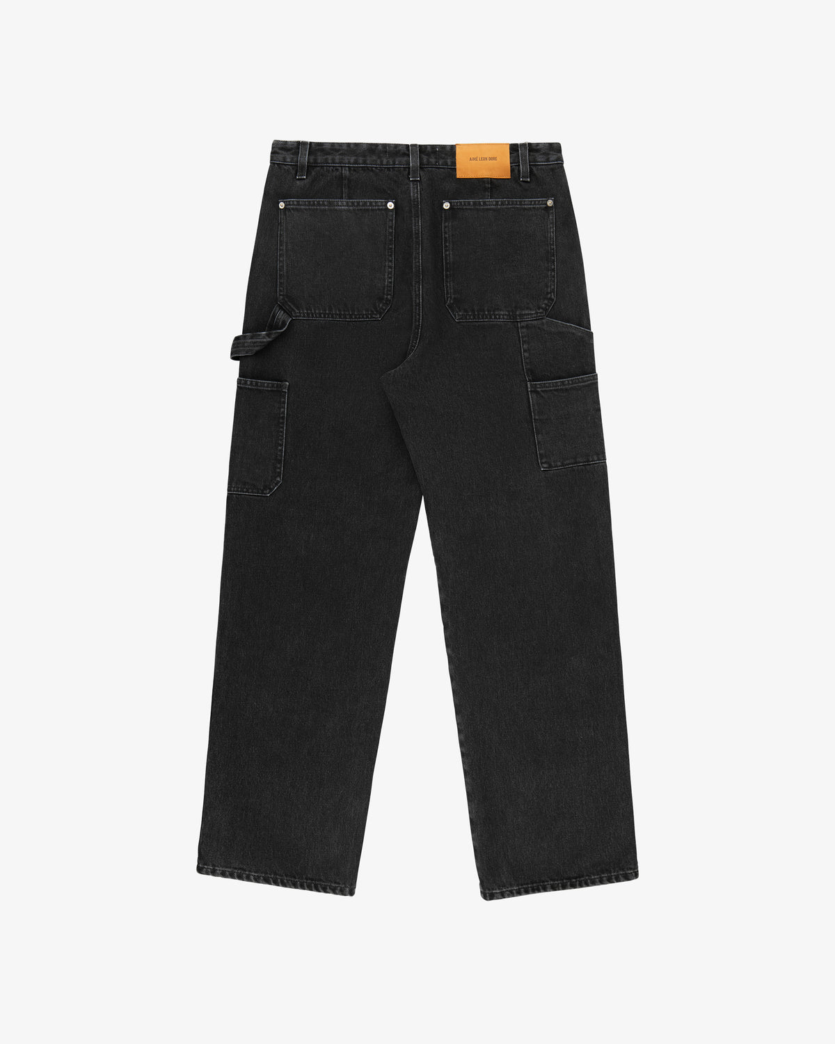 Back view of Denim Carpenter Pant in black with large back pockets, side utility pockets, and tan leather waistband patch.
