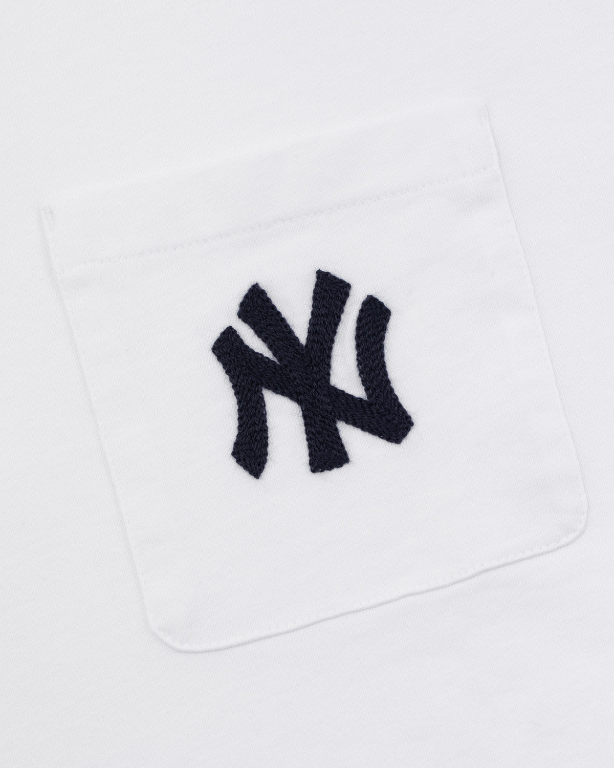 Yankees Chainstitch Pocket Tee featuring a white fabric pocket with a black embroidered Yankees logo on white background.
