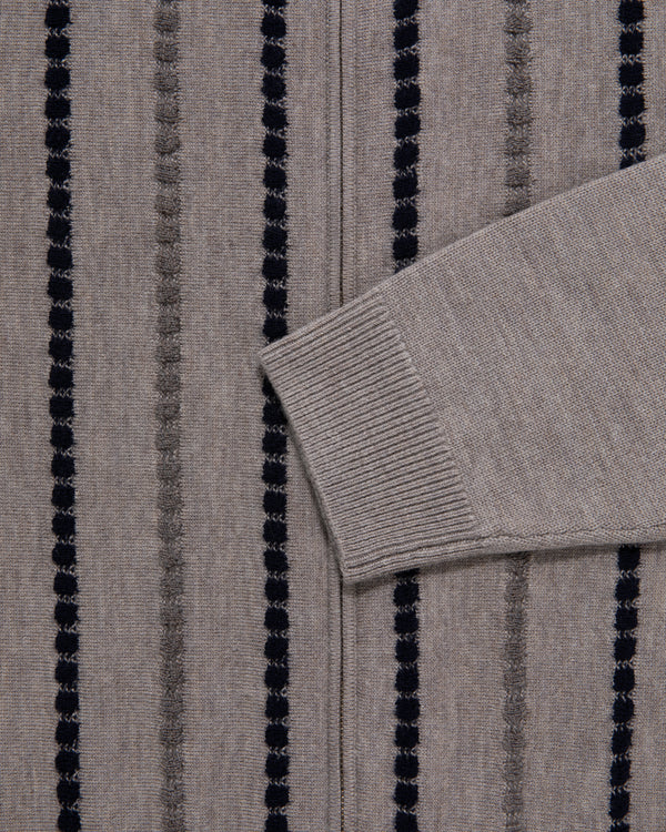 Close-up of sleeve and body of the Jacquard Stripe Polo Cardigan in gray with vertical black and dark gray stripes.
