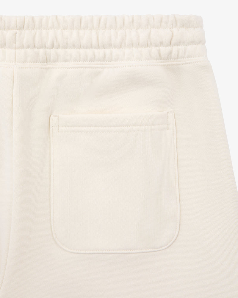 Close-up of Unisphere Sweatpants in cream with an elastic waistband and a single back patch pocket.