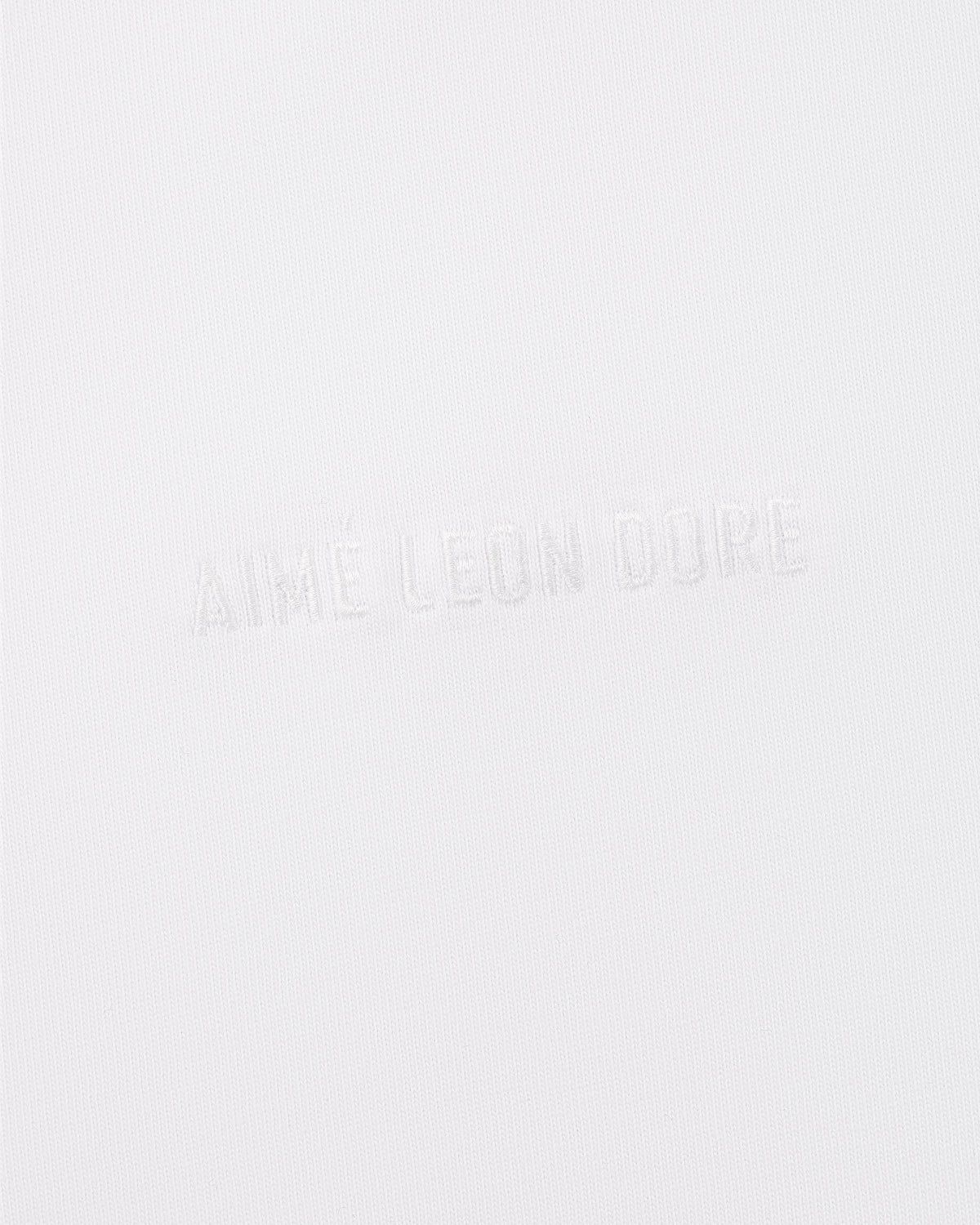 Long-Sleeve Tonal Logo Tee in white with subtle AIMÉ LEON DORE embossing for a minimal, clean look.