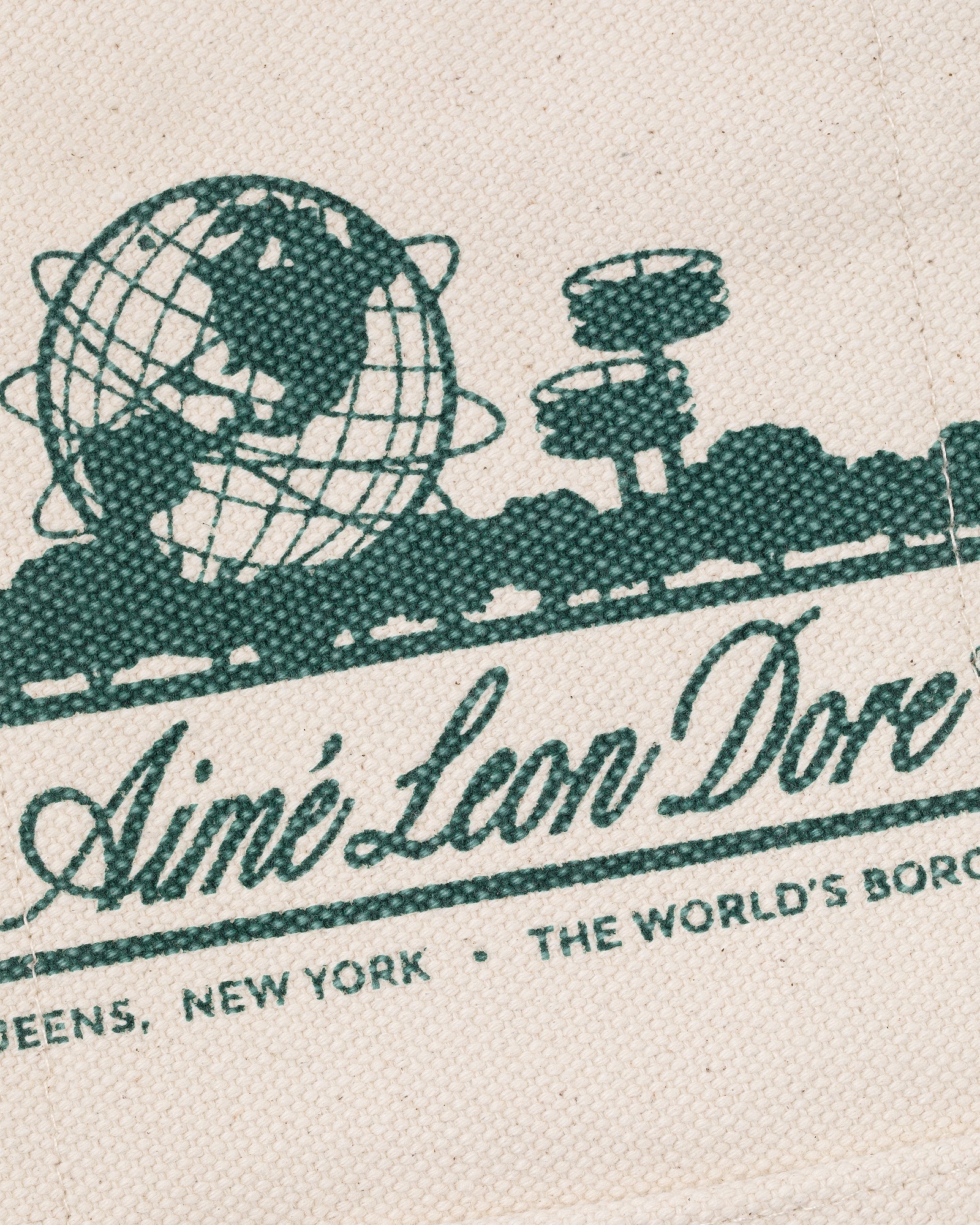 Green globe and structures graphic above "Aimé Leon Dore" with "Queens, New York, The World’s Borough" text. Mini Unisphere Tote Bag.