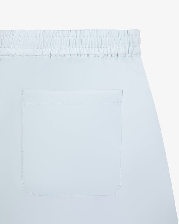 Cotton Lounge Pant in light blue with elastic waist and one back patch pocket, shown close up from the rear.