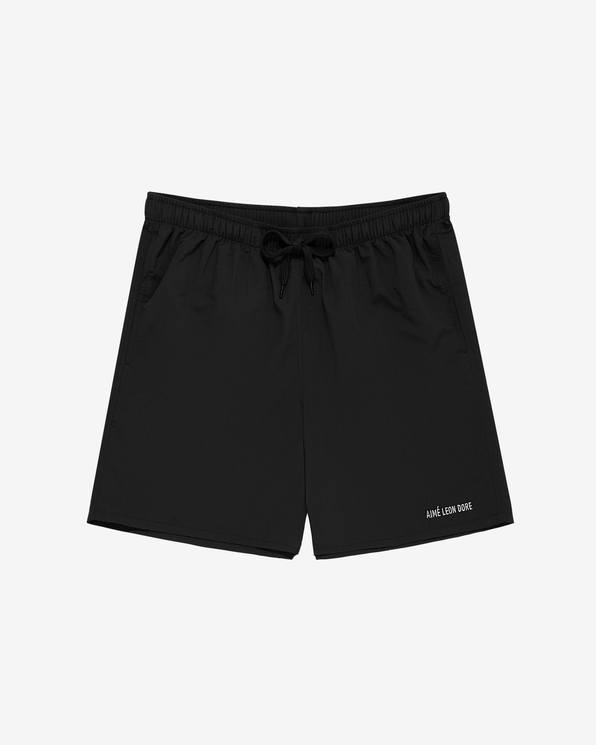 Core Nylon Short in black with side pockets and AIMÉ LEON DORE text on left leg, shown on a white background.