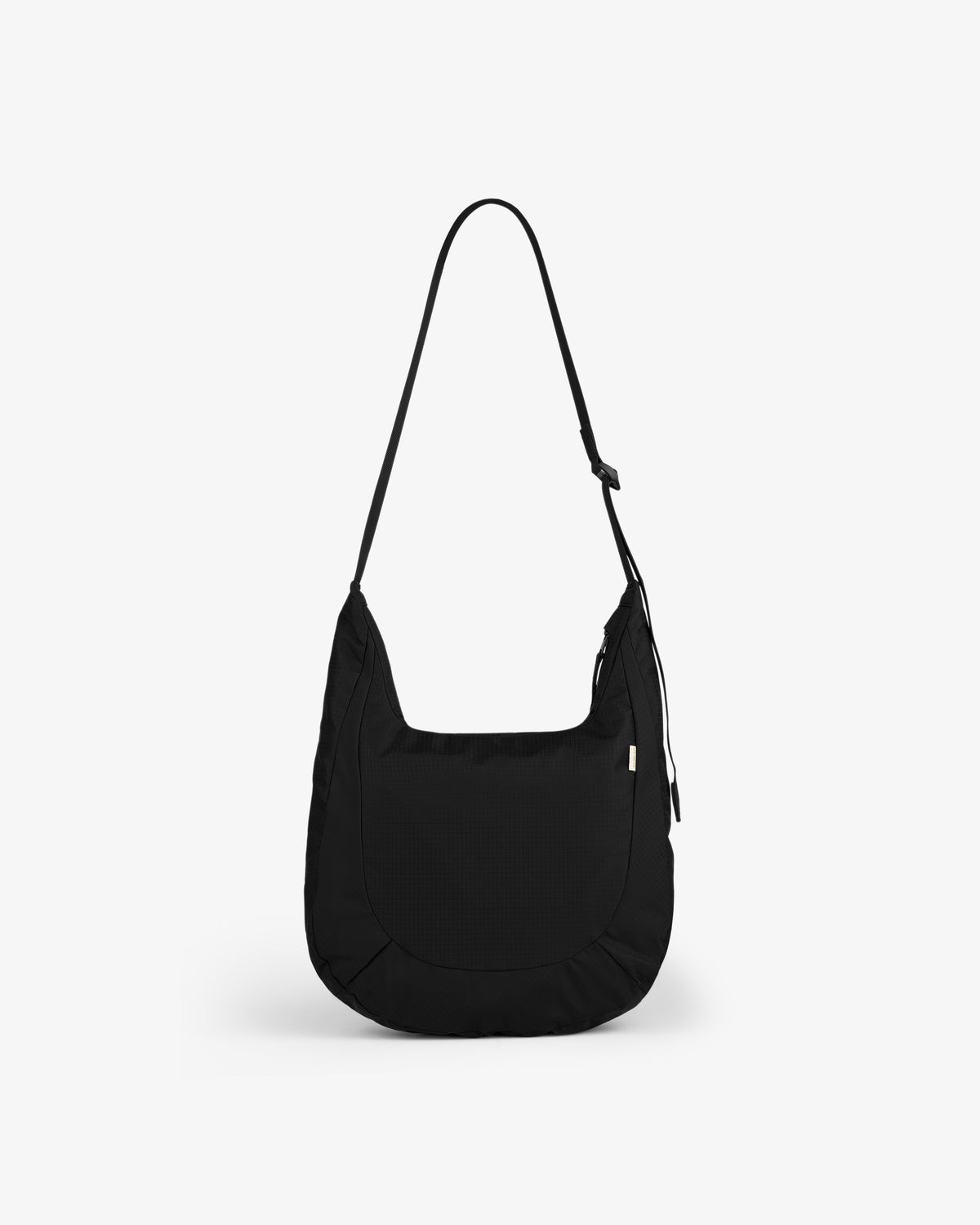 Black Nylon Messenger Bag with a curved shape and long strap, shown on a plain white background.