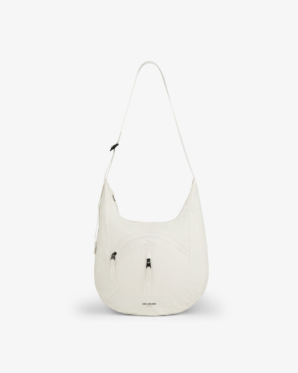 White Nylon Messenger Bag, crescent-shaped with front zipper pocket, shown on a plain white background.