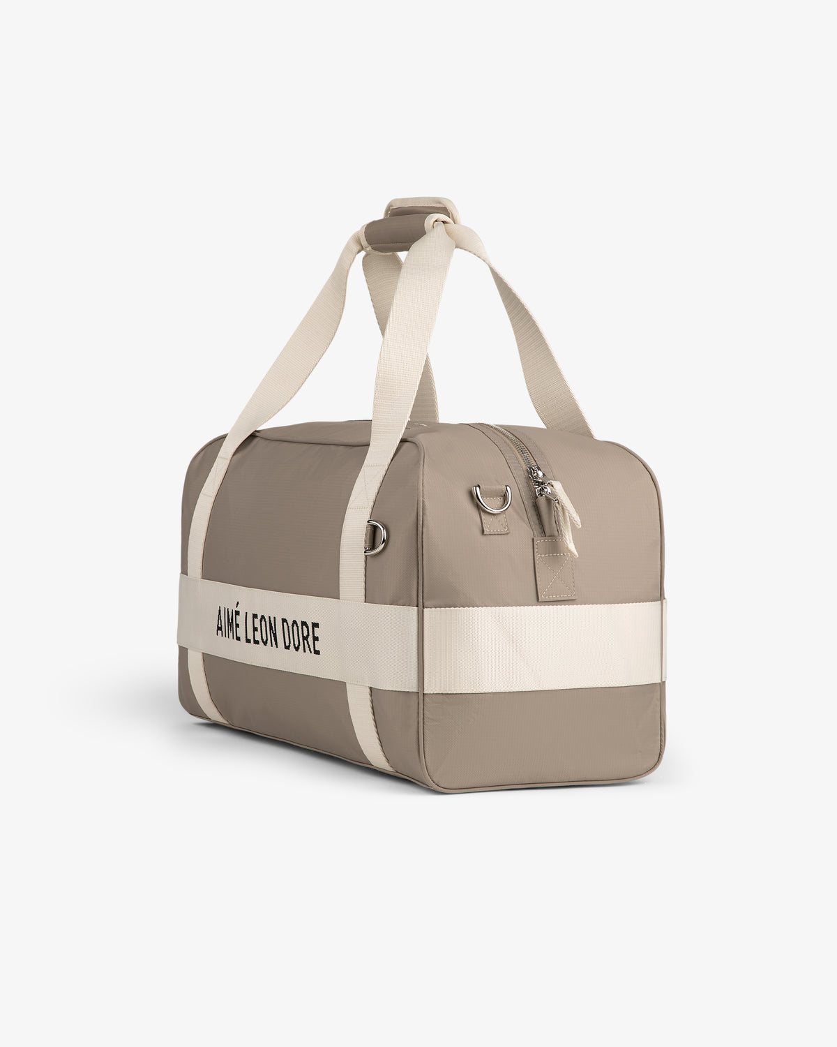 Nylon Duffle Bag in beige with white straps and black AIMÉ LEON DORE text, shown on a white background.