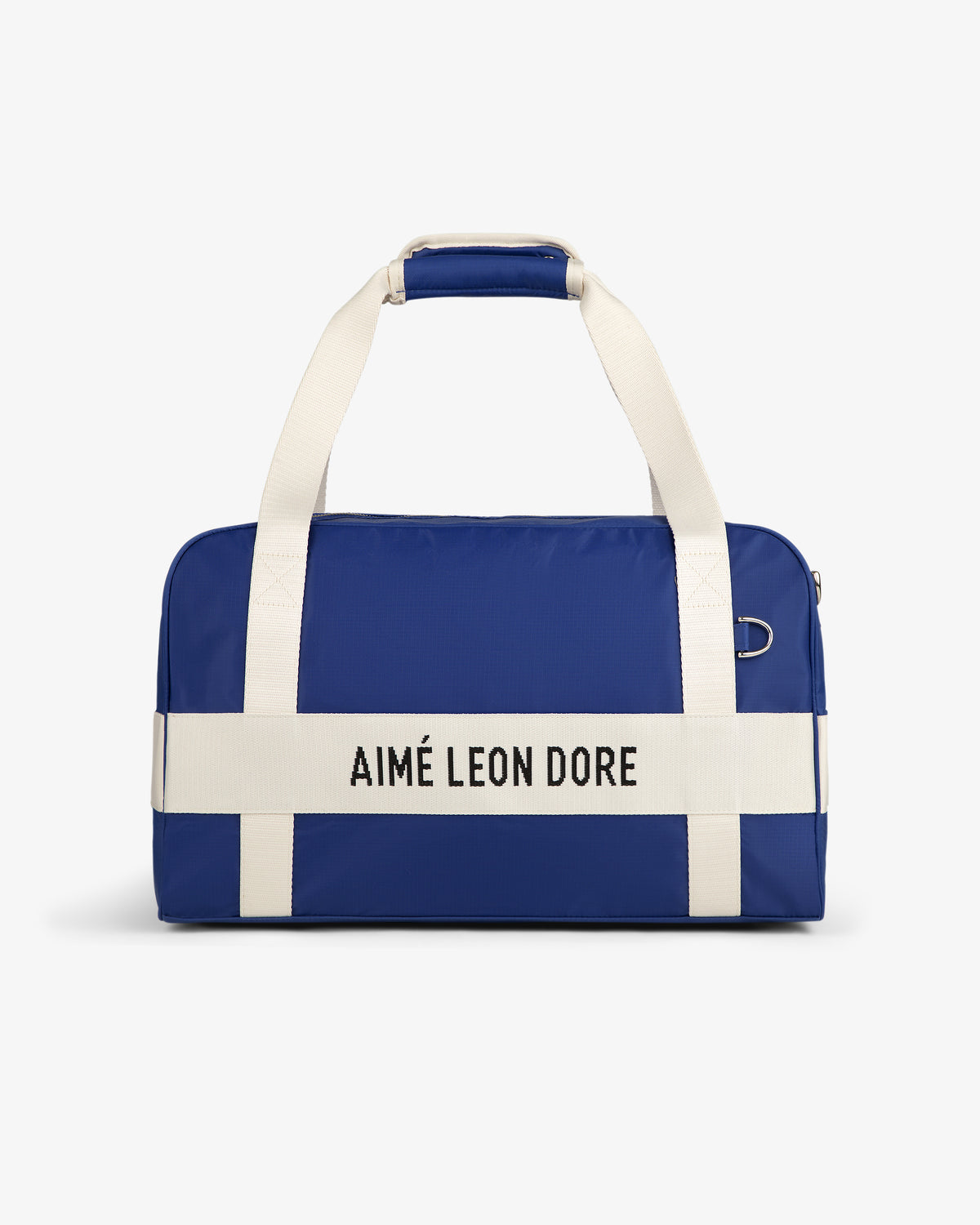 A blue Nylon Duffle Bag with white handles and AIMÉ LEON DORE on the front white strap.