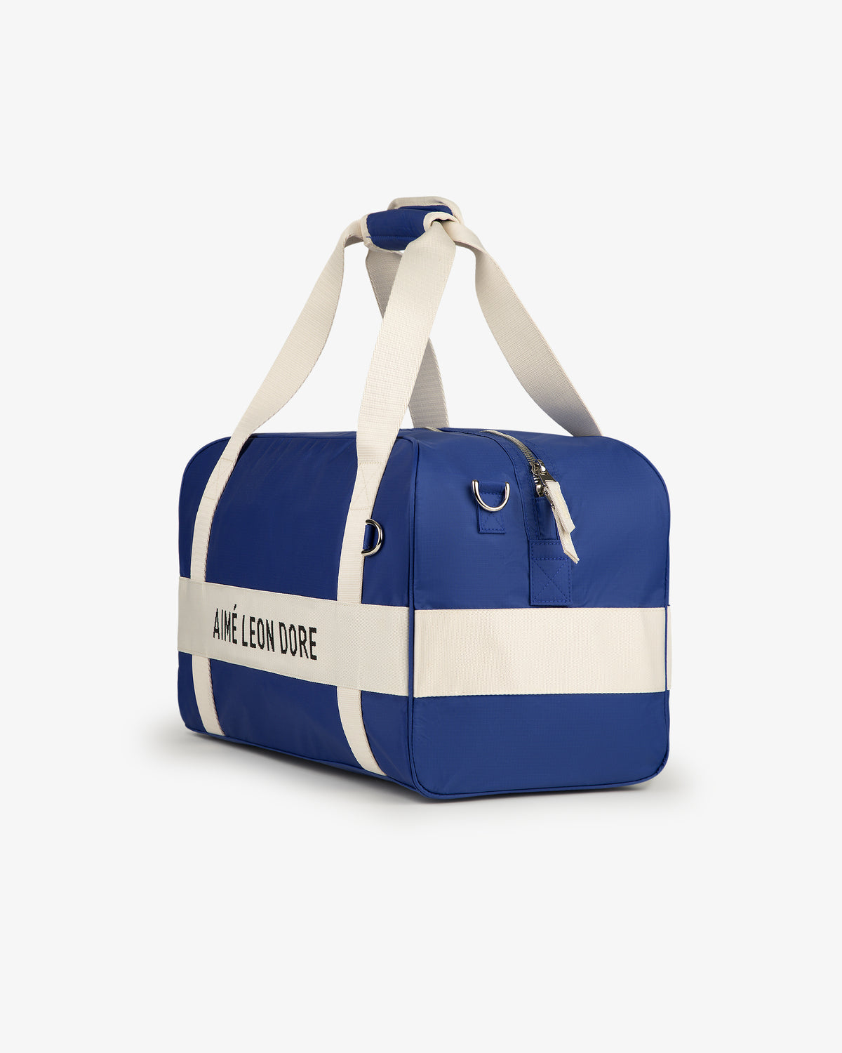 A Nylon Duffle Bag in blue with white straps, a white stripe, and AIMÉ LEON DORE text on the side.