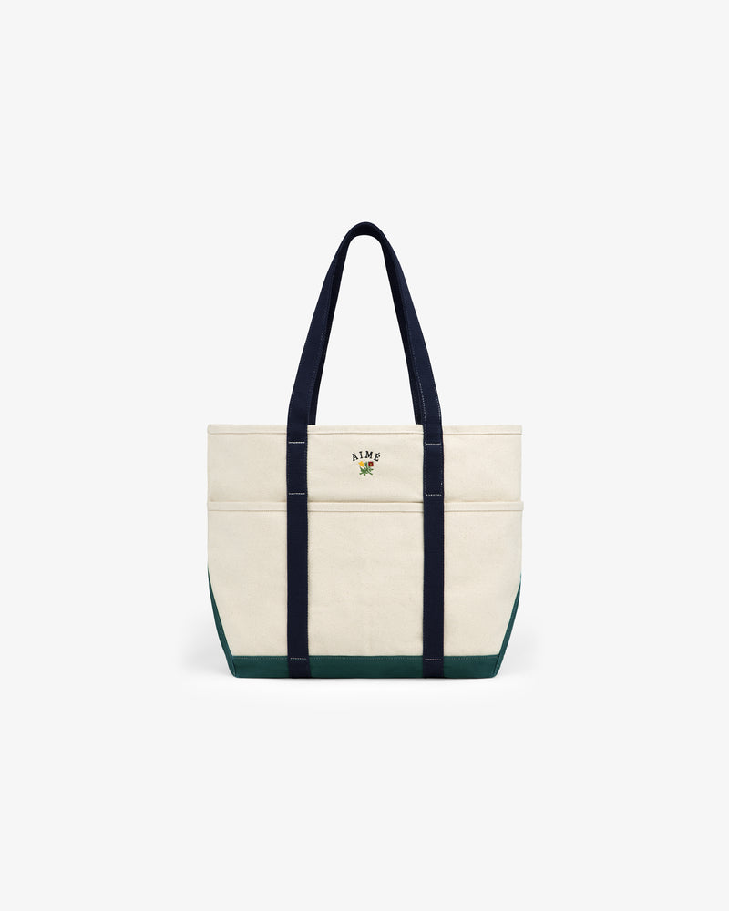 Large Crest Contrast Tote Bag with navy handles, green base, and small embroidered front-center design.