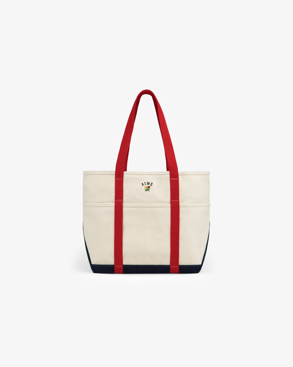 Large Crest Contrast Tote Bag with red handles, navy trim, and small floral ALME logo embroidered on the front.