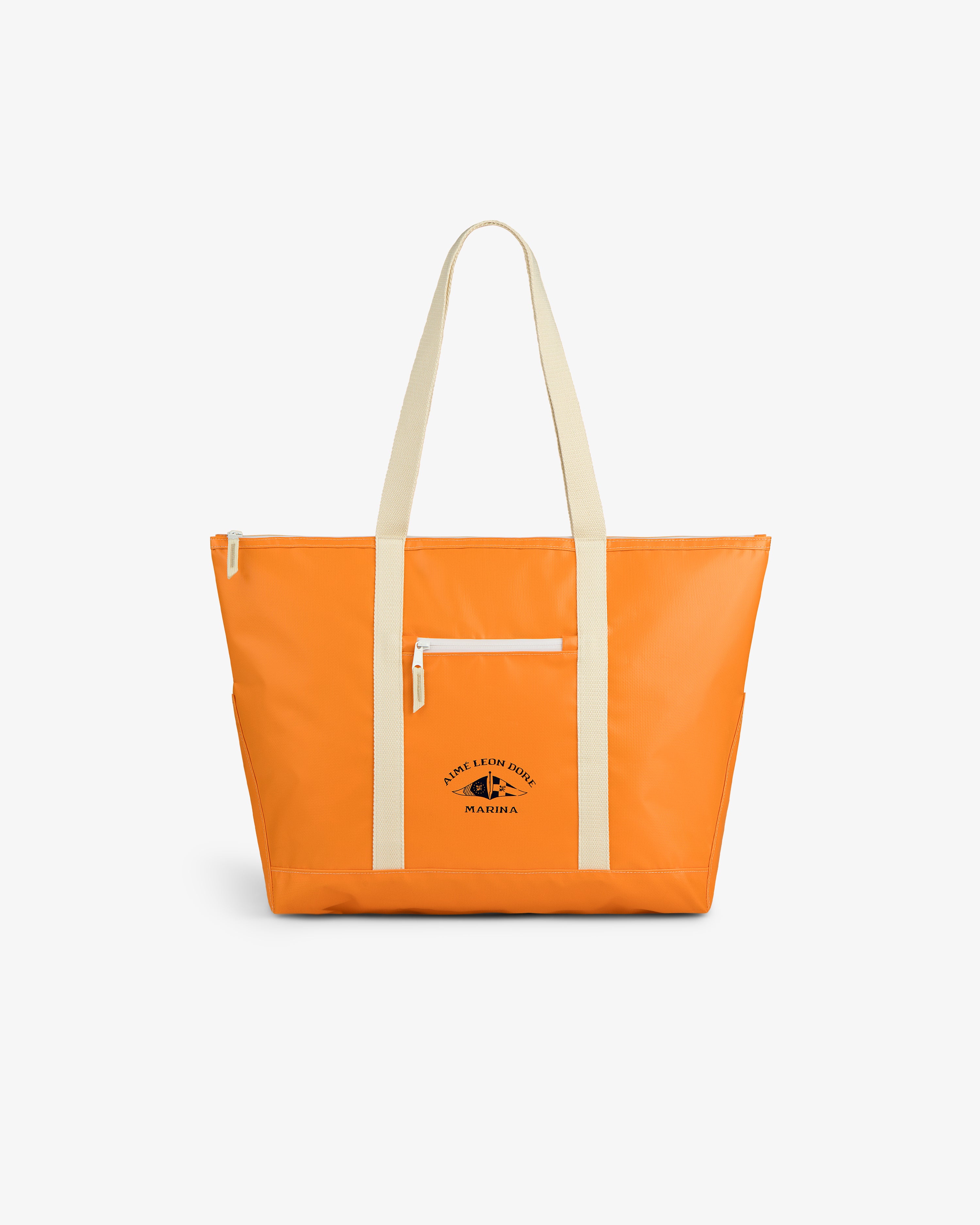 Carryall Marina Tote: Bright orange with cream handles/trim, front zip pocket, and small black logo.
