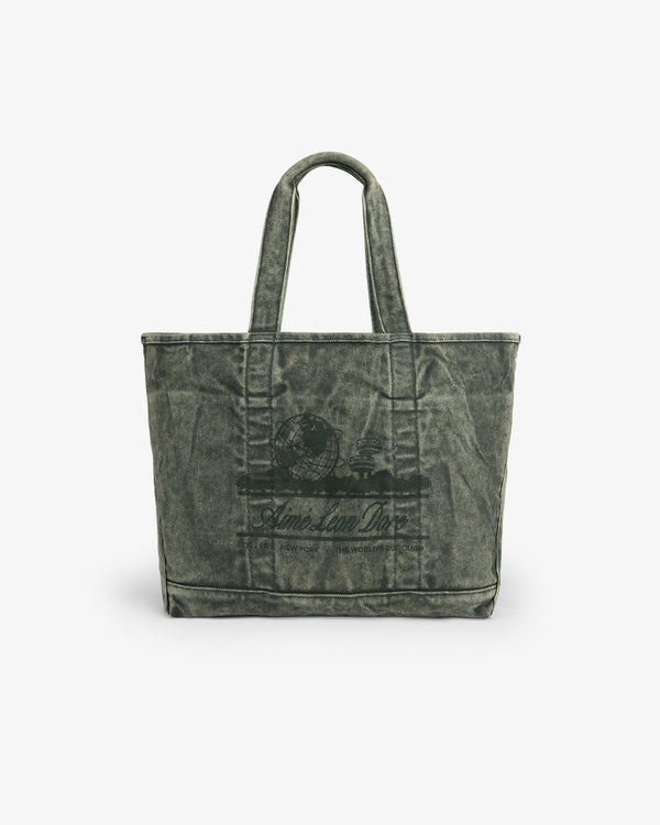 The Sun Faded Large Unisphere Tote Bag is green canvas with double handles and a dark print on the front.