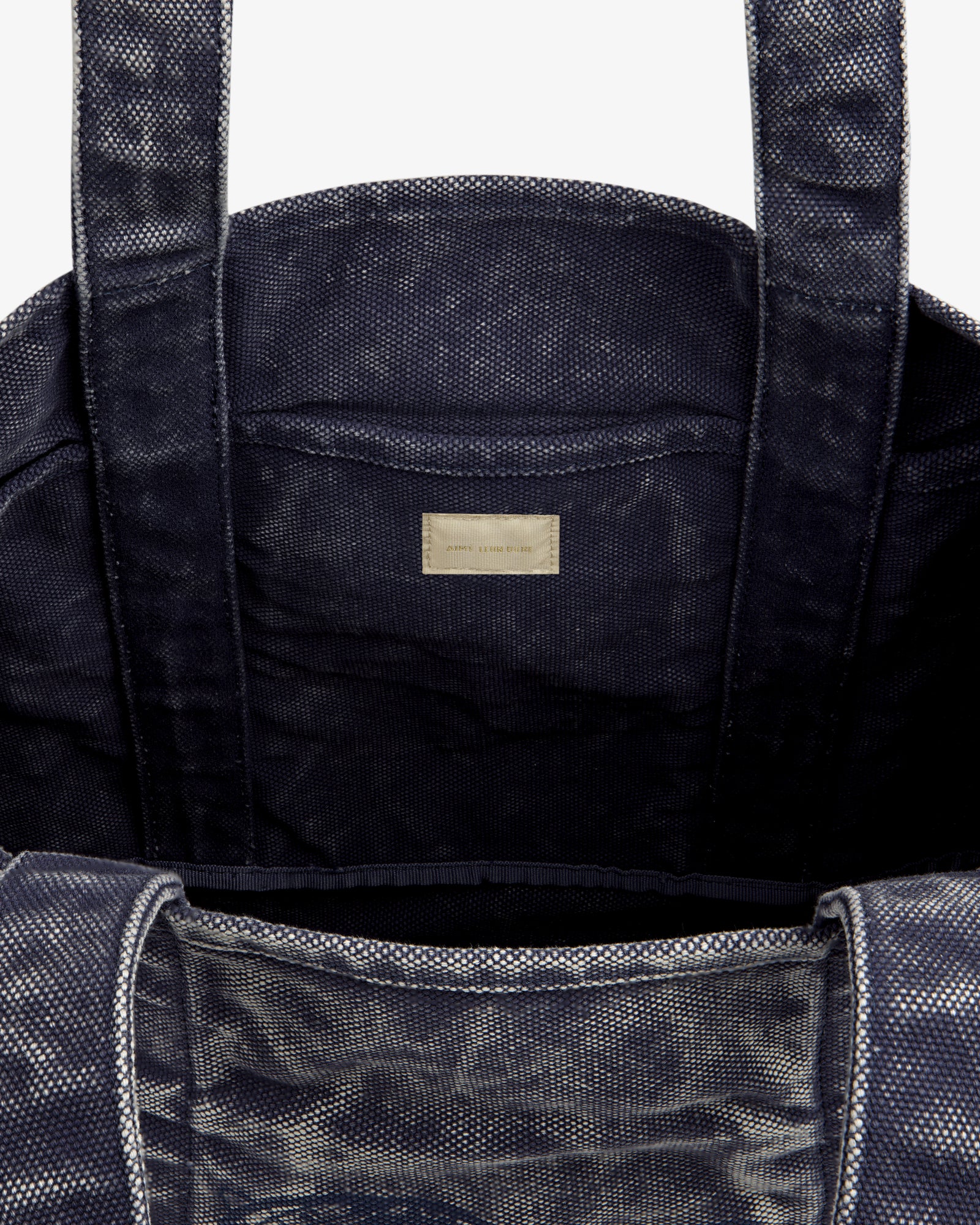 Sun Faded Large Unisphere Tote Bag in navy, open with sturdy handles and inner label, shown on a white background.
