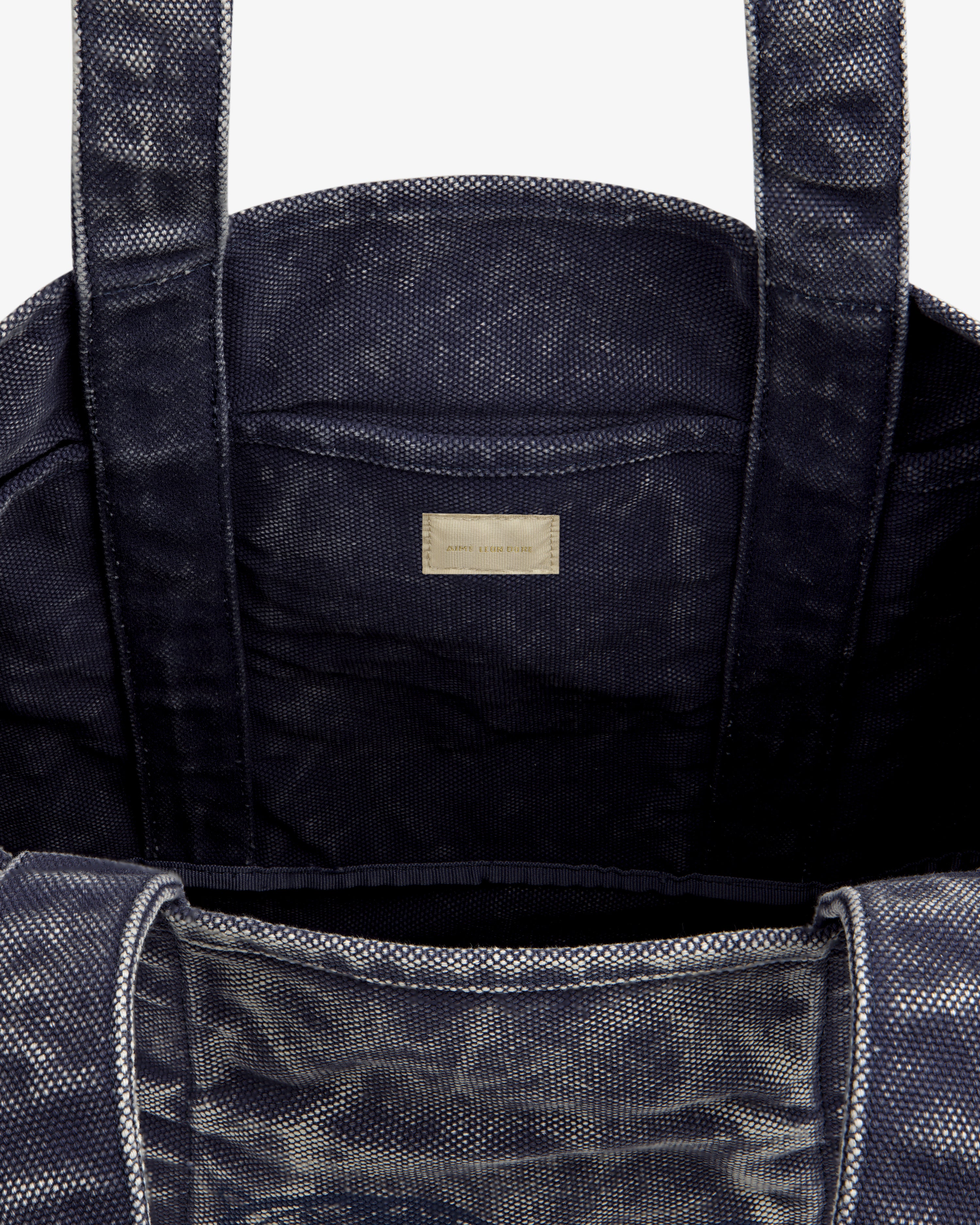 Sun Faded Large Unisphere Tote Bag in navy, open with sturdy handles and inner label, shown on a white background.