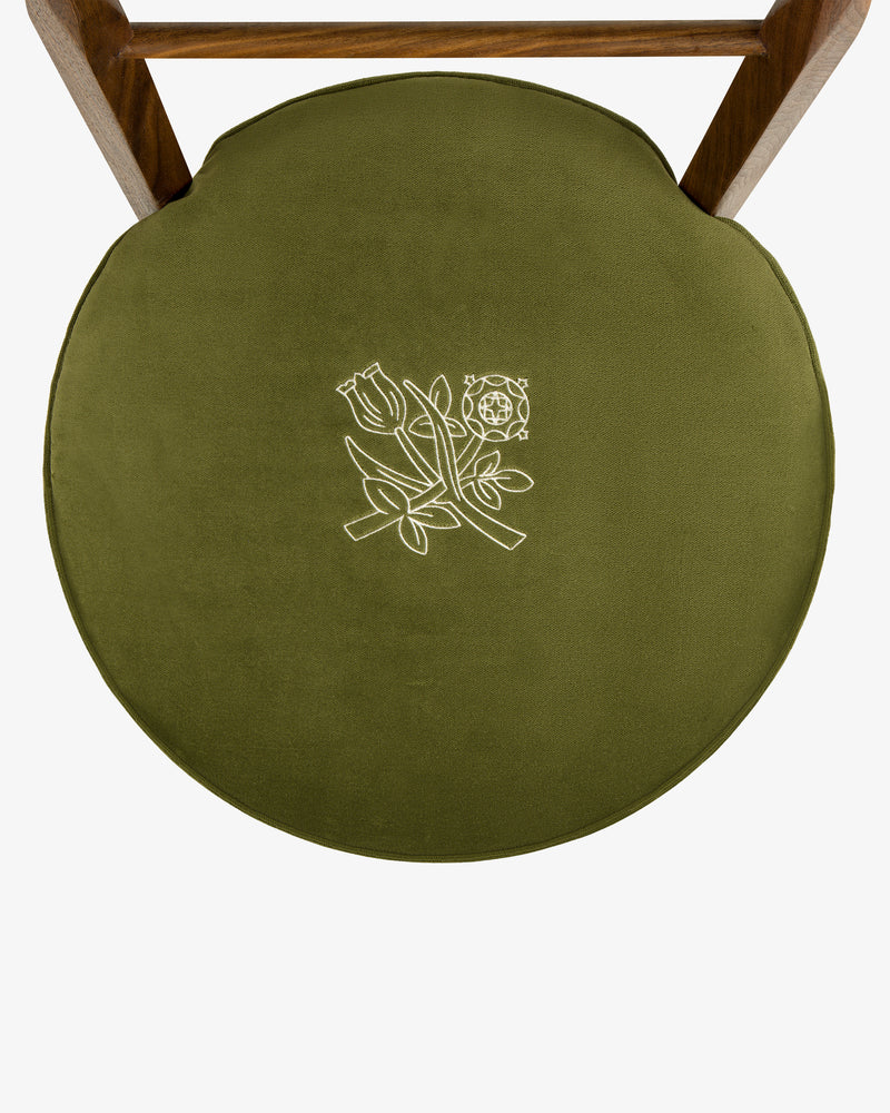 Queens Crest Valet Chair with green round seat and white floral embroidery, viewed from above on white background.