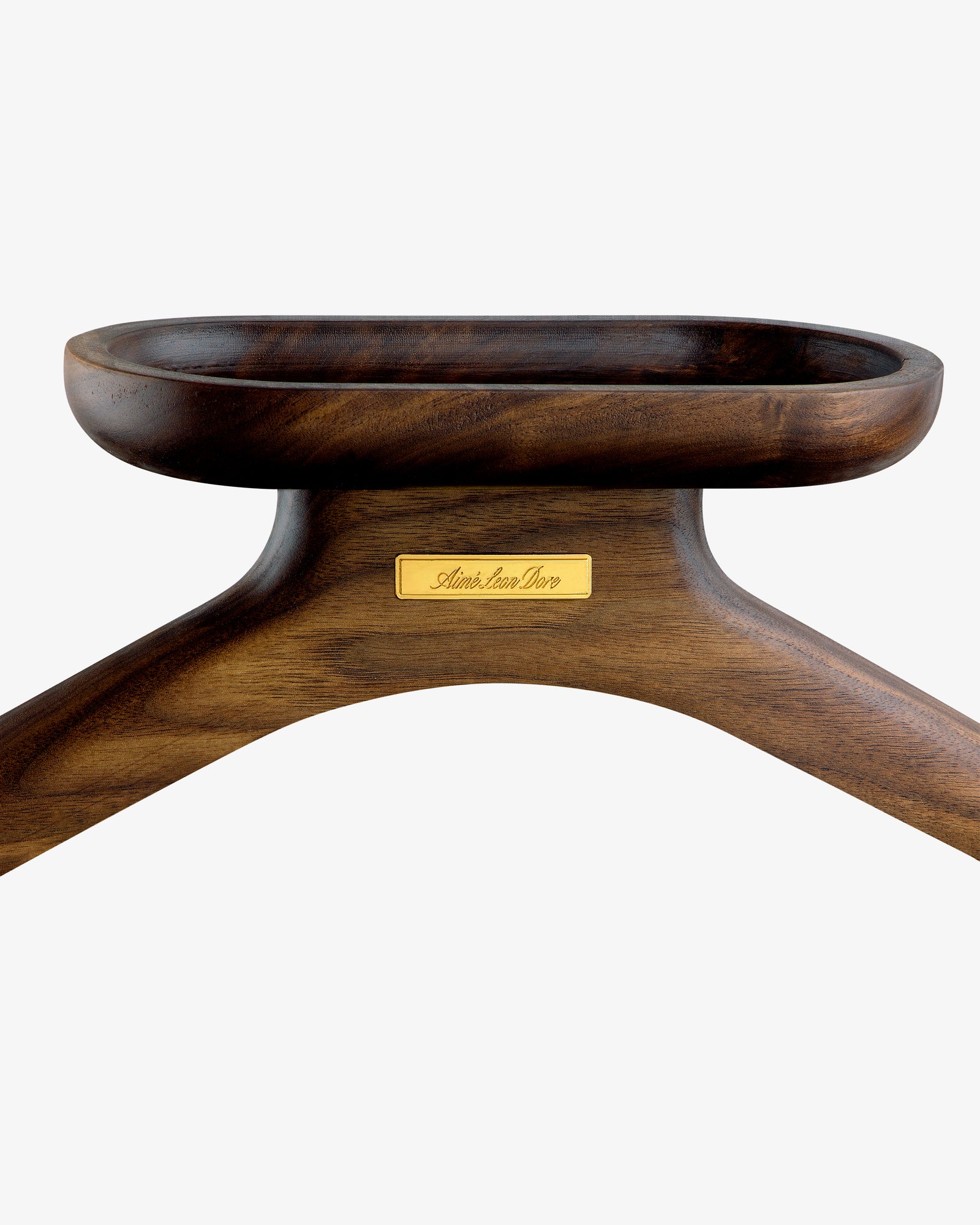 Close-up of a dark wooden Queens Crest Valet Chair featuring a gold nameplate on a white background.