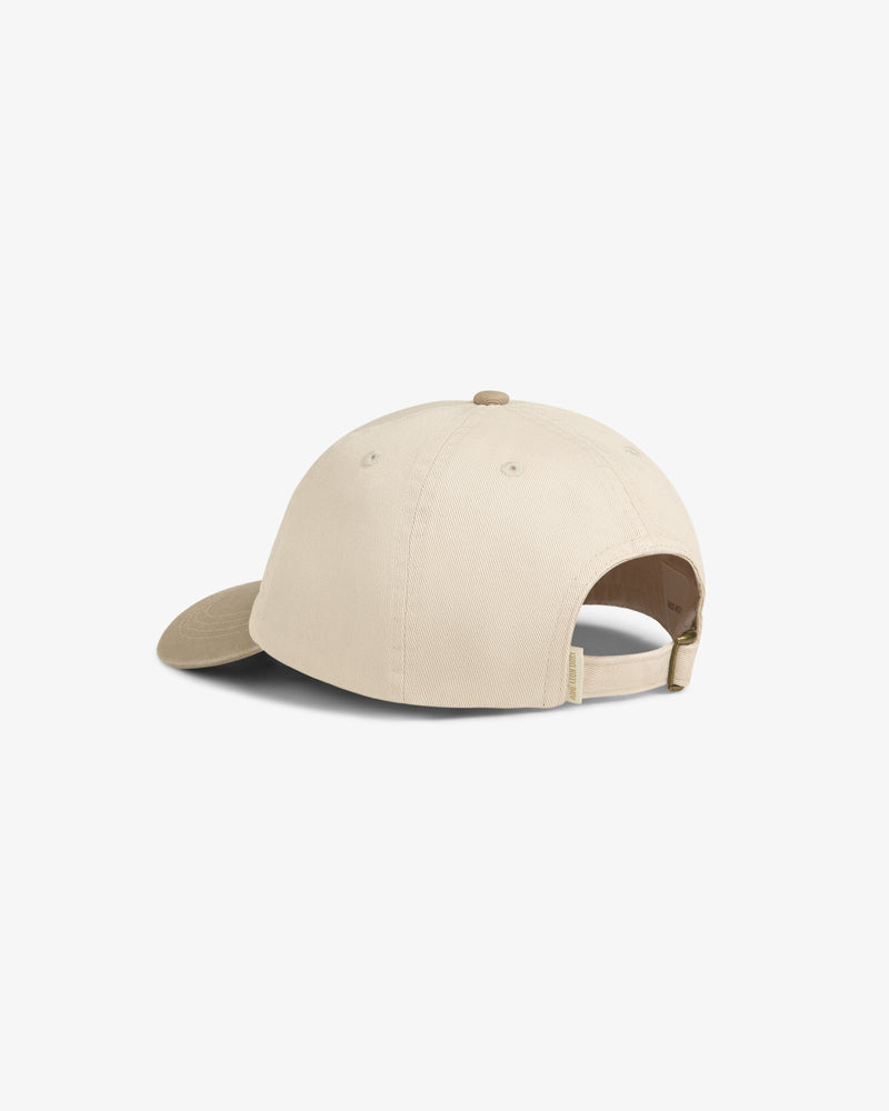Washed Chino Hat in beige shown from the back, with adjustable strap and curved brim on a white background.