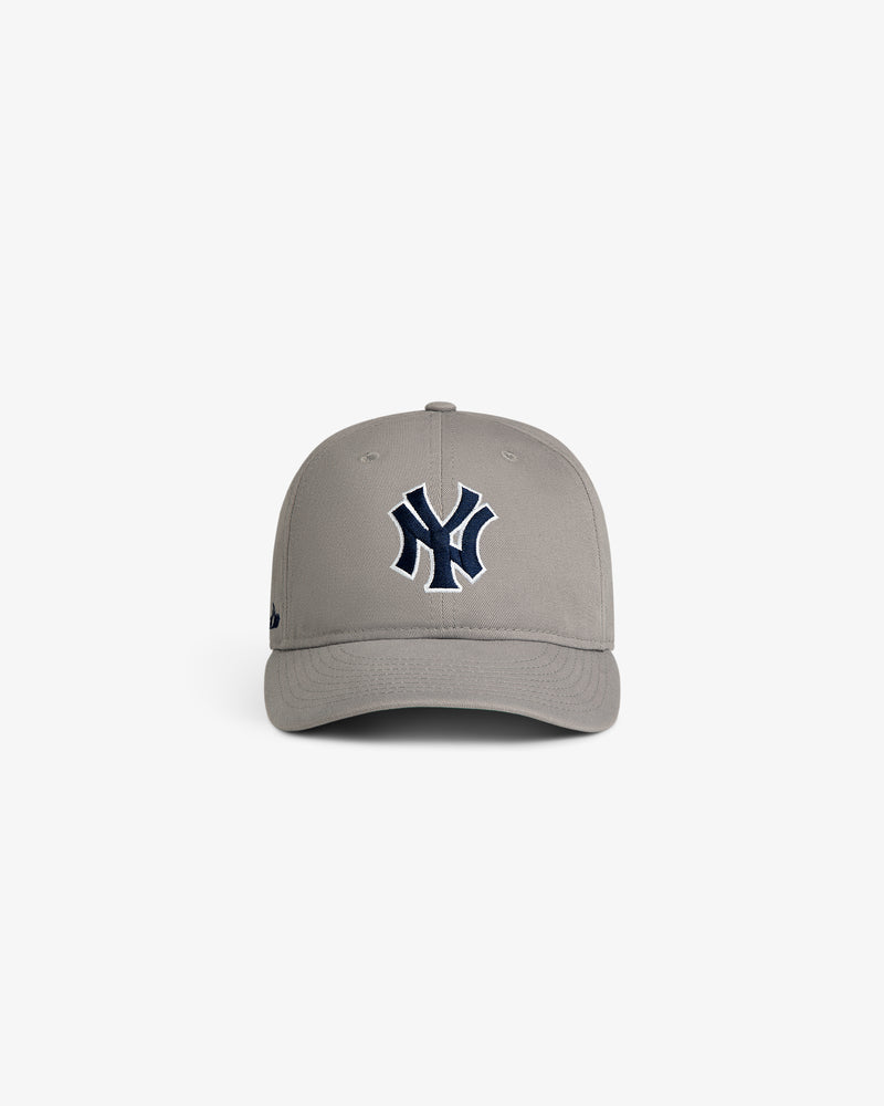 ALD / New Era Yankees Retro Fit Hat in gray with dark blue Yankees logo, shown on a white background.