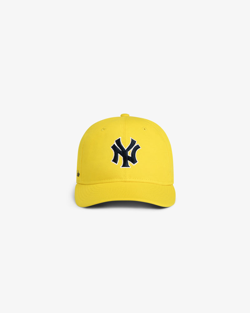 ALD / New Era Yankees Retro Fit Hat in yellow with black & white Yankees logo, shown on a plain white background.