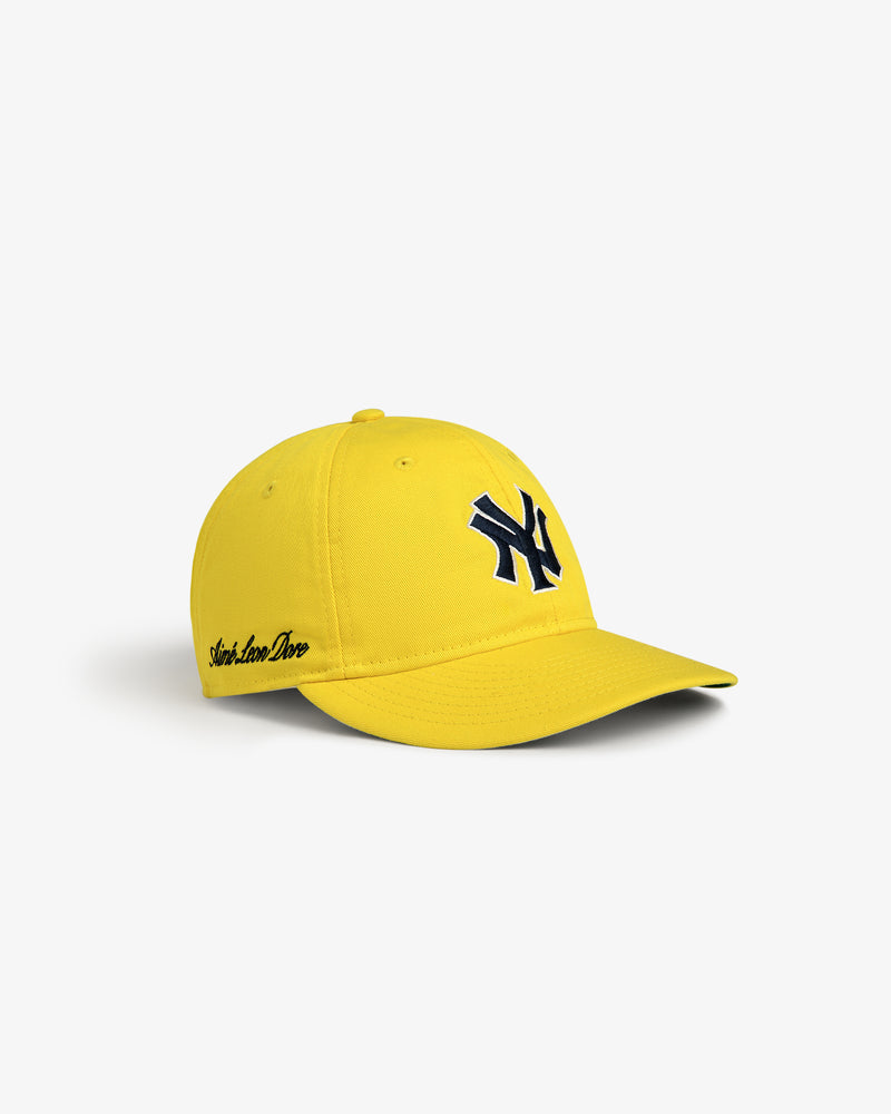 ALD / New Era Yankees Retro Fit Hat: bright yellow cap with dark blue NY logo and black script on white background.