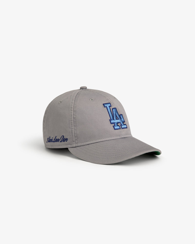 ALD / New Era Dodgers Retro Fit Hat—gray cap with blue LA logo and Aimé Leon Dore embroidery, shown on white.