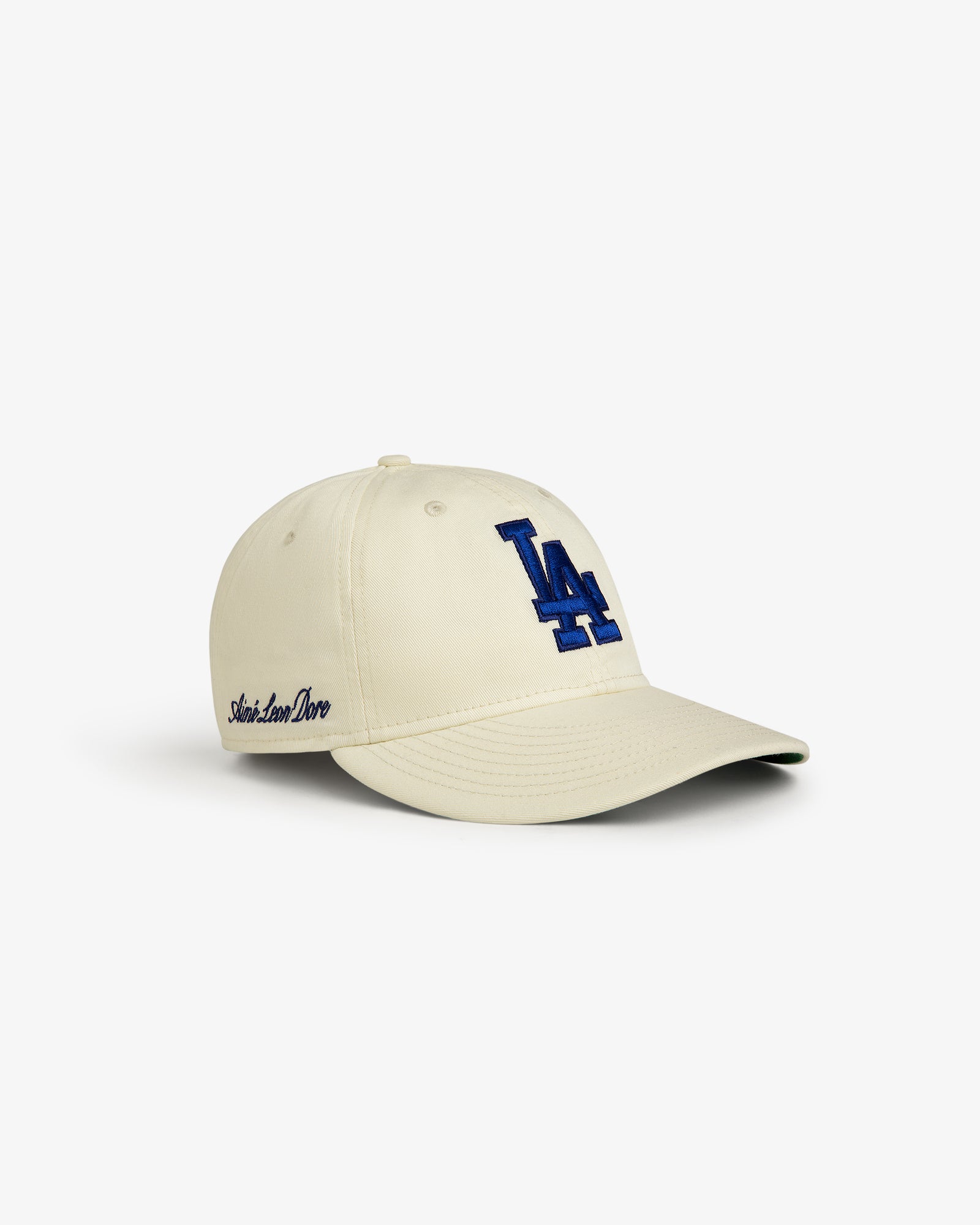 Beige ALD / New Era Dodgers Retro Fit Hat with blue LA logo and Aimé Leon Dore text on the side.