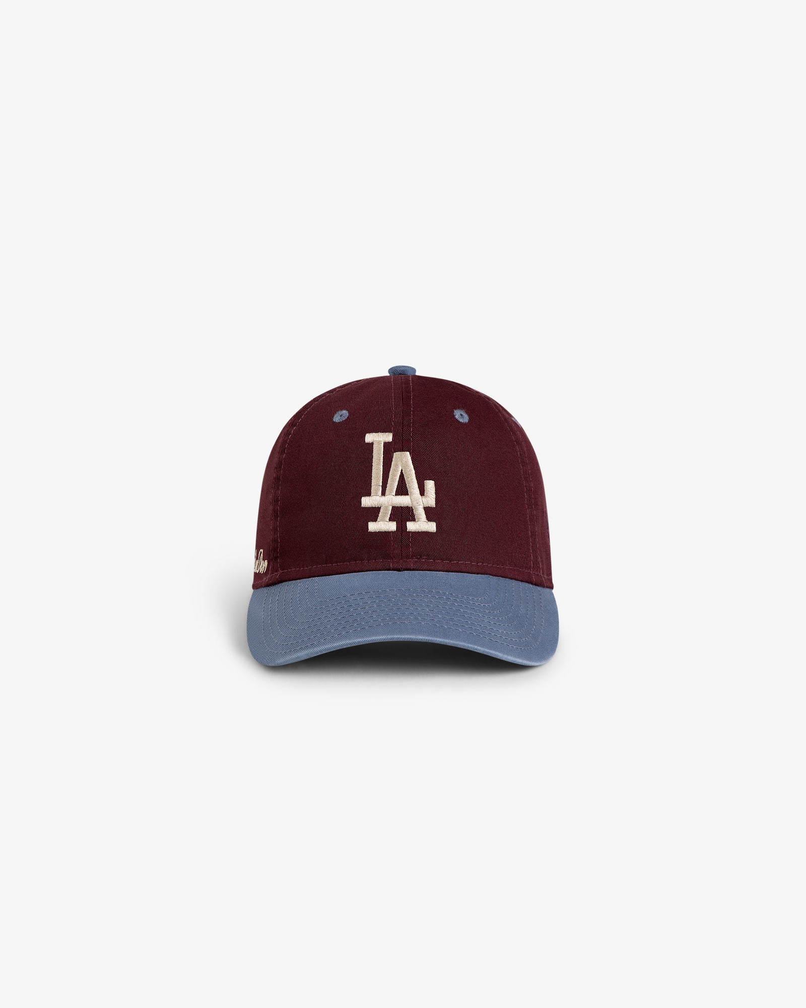 The ALD / LA Dodgers Colorblock Ballpark Hat features a maroon crown, white LA logo, and light blue brim.