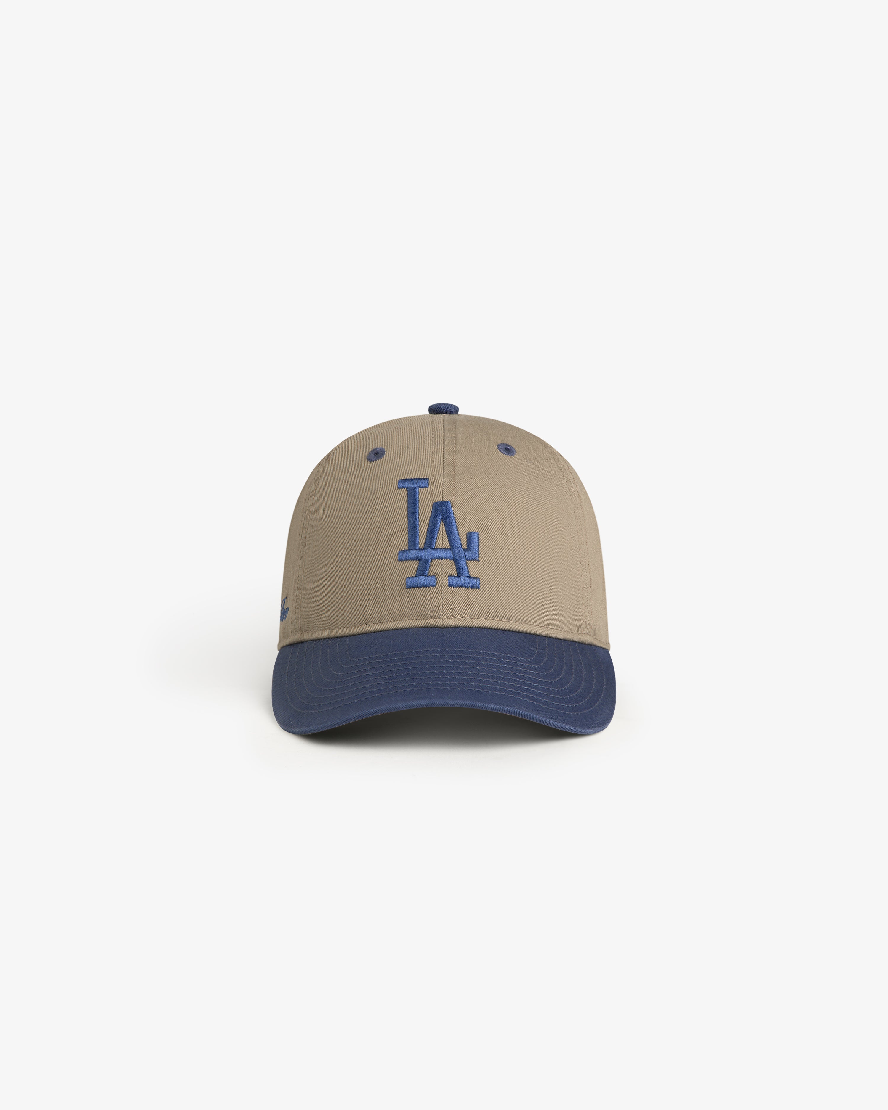 ALD / LA Dodgers Colorblock Ballpark Hat: tan cap with blue brim and blue LA logo, shown on a white background.