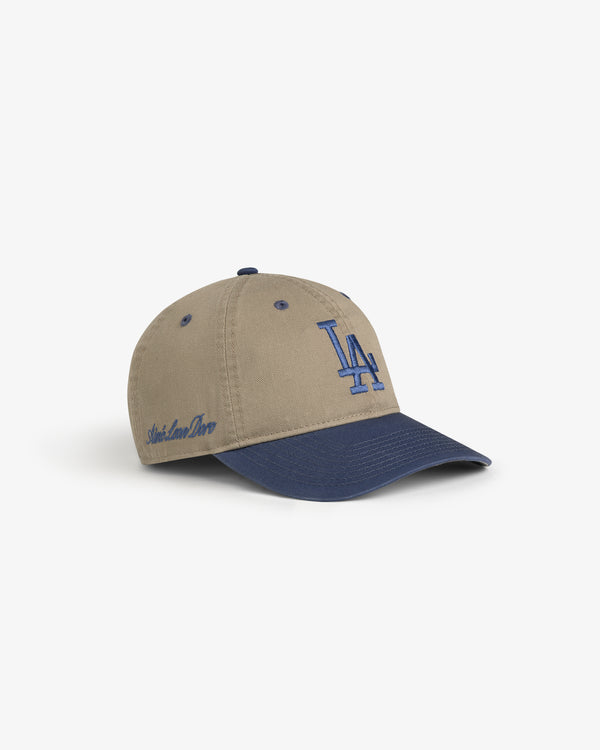 ALD / LA Dodgers Colorblock Ballpark Hat: Tan cap, blue brim, LA logo front, Aimé Leon Dore text side.