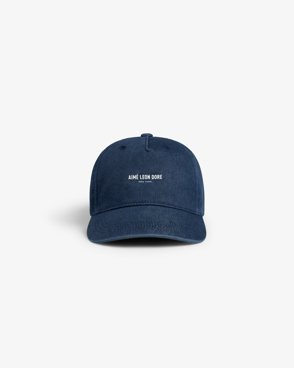 Vintage Micro Logo Hat in navy with white AIMÉ LEON DORE embroidery, displayed on a plain white background.