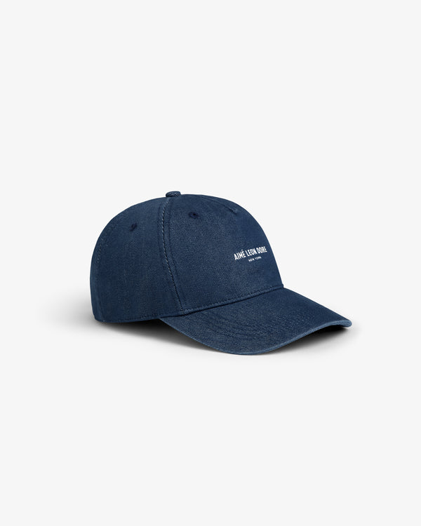 Vintage Micro Logo Hat in navy blue with a curved brim and small white front text, shown on a white background.