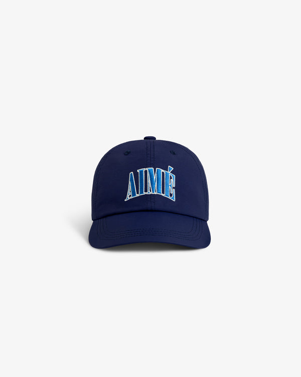 A navy Nylon Crusher Hat with AIMÉ embroidered in blue and white letters on the front.